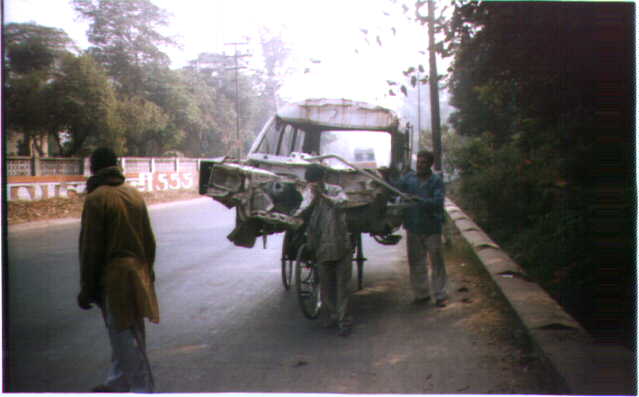 The humble but ubiquitous rickshaw, whose contribution to the Indian Economy perhaps equals those of many large industries. Note the front wheel is not on the ground.
